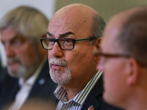 Tecumseh Mayor Gary McNamara, seen in this file photo flanked by Lakeshore Mayor Tom Bain and Windsor Mayor Drew Dilkens, is worried about how the province's Bill 148, the Fair Workplaces, Better Jobs Act, will affect municipalities.