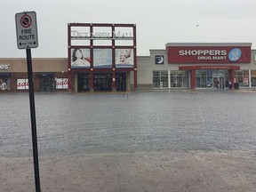 A view of the lake of water surrounding the main entrance of Tecumseh Mall on Sept. 29, 2016. The mall was forced to close for the day due to the amount of flooding.