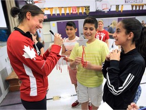 Canadian Olympic track athlete Noelle Montcalm signs autographs at W.J. Langlois Catholic Elementary School in Windsor on Thursday, Sept. 22, 2016. The graduate of the school shared her recent experiences at the Rio Olympics.