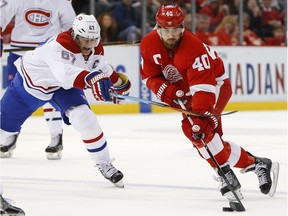 Montreal Canadiens' Max Pacioretty (67) defends against Detroit Red Wings' Henrik Zetterberg (40) in the second period of an NHL hockey game on March 24, 2016 in Detroit.