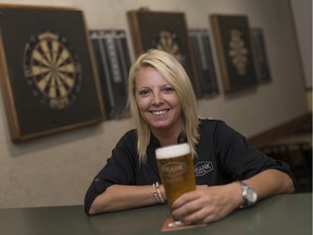 Lisa Morand, sales representative for FRANK Brewing Co., is pictured with a pint of beer at the McGregor Knights of Columbus Friday, September 16, 2016.  FRANK Brewing Co. is one of the local breweries participating in the McGregor Mug Run and International Beer Fest taking place Saturday, September 24, 2016.