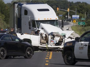OPP officers investigate after a head-on collision between a transport truck and a pickup truck on Highway 3 between County Rd. 34 and County Rd. 31 on Sept. 1, 2016.
