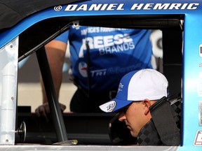 Daniel Hemric, driver of the #19 DrawTite Ford, sits in his car during qualifying for the NASCAR Camping World Truck Series Careers for Veterans 200 at Michigan International Speedway on Aug. 27, 2016 in Brooklyn, Mich.