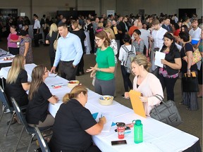 A job fair attended by 11 local companies was held at the St. Clair Centre for the Arts on Wednesda. A full room of applicants waited in line to meet potential employers during the event.