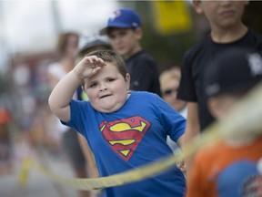 Drew  Cabral, 4, looks to see what's next in the Harrow Fair parade, Saturday, Aug. 3, 2016.  This is the 162nd Harrow Fair.