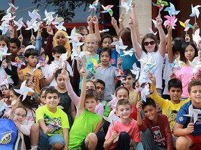 Students from Dougall Public School made a colourful expression of their feelings about living in peace, on Wednesday, Sept. 21 in Windsor. It was the International Day of Peace as designated by the United Nations. Working with members of Rotarians from Club 1918, students in Grades 4, 5 and 6 created pinwheels. Millions of students throughout the world have created Pinwheels for Peace as a symbol for the special day. Students are shown with their pinwheels.