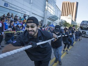 Louis Moro leads his team from Laval during the Ram Tough Truck Pull for United Way Windsor and Essex County in downtown Windsor, Sunday, September 25, 2016.