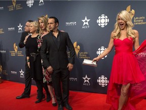 Shelby Fenner (right) arrives on the red carpet as Mark Critch, Cathy Jones, Susan Kent and Shaun Majumder pose for a photo at the 2015 Canadian Screen Awards in Toronto on Sunday, March 1, 2015.