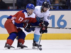 Team Czech Republic's Vladimir Sobotka, left, and Team Europe's Frans Nielsen battle for the puck during first period World Cup of Hockey action in Toronto on Sept. 19, 2016.