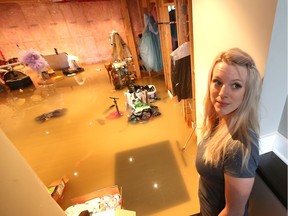 Natalie Mannina shows her flooded basement at her home on  Lacasse Boulevard in Tecumseh on Thursday, Sept. 29, 2016.