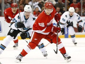 Detroit Red Wings left winger Teemu Pulkkinen (56) handles the puck against the San Jose Sharks in the second period of an NHL hockey game on Nov. 13, 2015 in Detroit.