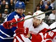 Toronto Maple Leafs'  Brad Boyes and Xavier Ouellet of the Detroit Red Wings in a pre-season game on Oct. 3, 2015 at the Air Canada Centre in Toronto.