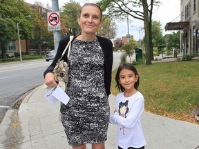 Jowita Czarnecka and her daughter Sybella Jamali are shown in front of the Windsor-Essex County Health Unit on Monday, Sept. 26, 2016 in Windsor. Jamali, a Grade 3 student, was among many local children to be suspended from school for not having their vaccination records updated.