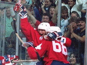 Wayne Gretzky, left, and Mario Lemieux celebrate Lemieux's goal in Canada Cup game against the Soviet Union in Sept. 1987.