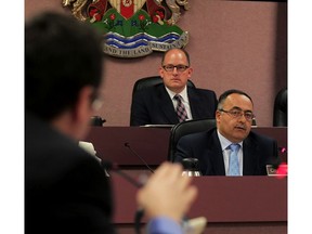 In this file photo, Coun. Irek Kusmierczyk, left, asks a question of City Treasurer Onorio Colucci, right, and Mayor Drew Dilkens during a special meeting of City Council to discuss development rates Monday, April 27, 2015.  (NICK BRANCACCIO/The Windsor Star)