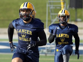 University of Windsor Lancers' Frank Renaud, left, is OUA's defensive player of the week for his performance in the team's upset of No. 6 Guelph.