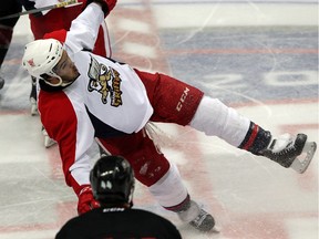 Grand Rapids Griffins defenceman Ryan Sproul goes sideways avoiding a hit against the Lake Erie Monsters in AHL action at the WFCU Centre Friday October 3, 2014.
