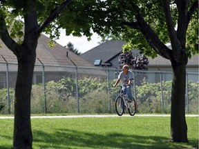 A cyclist cruises along the Riverside Drive trails in Windsor on Wednesday, September 14, 2016.