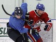 Steven Sartor, right, of the Lakeshore Canadiens collides with Curtis Rodriques of the Wheatley Omstead Sharks during junior C hockey action at the Atlas Tube Centre in Lakeshore on Friday, September 16, 2016.