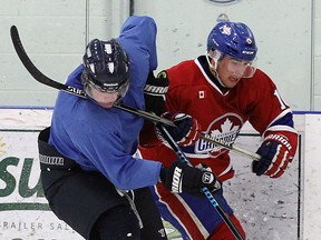 Defenceman Curtis Rodriques , seen in action on the left, is one of several veterans back this season for the Wheatley Sharks.