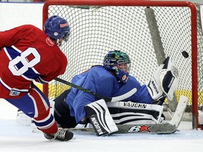 Lakeshore Canadiens' Lucas Gignac fires a shot at Wheatley Omstead Sharks' Erik Morneau at the Atlas Tube Centre in Lakeshore on Sept. 16, 2016.