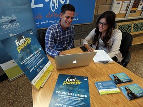 FINA volunteer co-ordinator Jake Clement and media manager Samantha Martin, right, sign up volunteers for the upcoming FINA meet in Windsor on Monday, September 19, 2016. The organizers are looking for close to 600 volunteers.