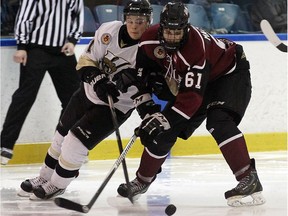 LaSalle's Manny Silverio, left, tries to steal the puck form the Chatham's Alec Mackenzie at the Vollmer Centre in LaSalle on Wednesday, September 21, 2016.