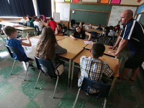 Teacher Mike Wallace leads his students as they try to ask the question "was math discovered or created?" during a Grade 7 and 8 math class at Marlborough Public School in Windsor on Sept. 6, 2016.