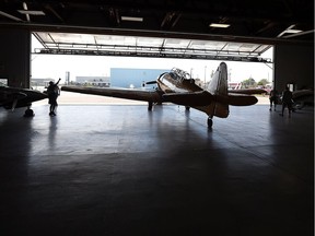 A Harvard airplane is pulled from the hangar at the Canadian Historical Aircraft Association at the Windsor Airport on Sept. 9, 2016.