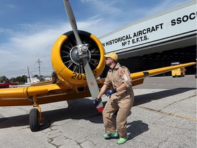 Pilot Dave Carrick prepares a Harvard airplane for takeoff at the Windsor Airport on Friday, September 9, 2016 in preparation for the Top Guns Kids Take Flight event.