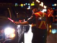 Windsor police officers stop drivers on Ojibway Parkway in August 2010 during a RIDE program.