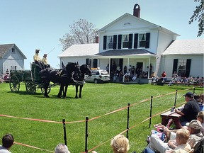 Kyle David and Katherine Von Flotow show a pair of Percheron horses during the 12th annual Parade of Horse Breeds at the John R. Park Homestead near Harrow on Sunday, May 23, 2010. The event offers the public the chance to learn about all the different breeds of horses.