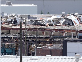 WINDSOR, ONTARIO - AUGUST 26, 2016 -  The Kautex Corporation roof was severely damaged from a tornado on Wednesday evening.  Crews continue to clean up the area of Kautex Drive,  Deziel Drive and St. Etienne Blvd. in Windsor, Ontario on August 26, 2016. (JASON KRYK/Windsor Star)