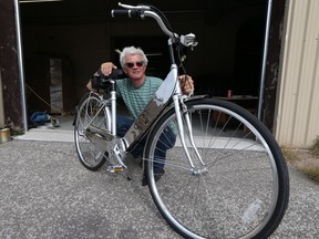 Robert Coyle shows off the new Celaris bicycle at the SGC headquarters on Sept. 22, 2016. The locally produced bicycle is expected to hit the market next spring.