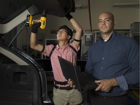 Xiaoxu Ji, left, a postdoctoral fellow at the University of Windsor, and Joel Cort, professor of kinetics at the University of Windsor, work with 3D motion capture technology to make assembly lines safer for workers at Ford's Windsor and Oakville plants.