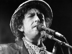 This file photo taken on June 3, 1984 shows US singer Bob Dylan performing during a concert at the Olympic stadium in Munich, southern Germany. US songwriter Bob Dylan won the Nobel Literature Prize on October 13, 2016, the first songwriter to win the prestigious award and an announcement that surprised prize watchers. / AFP PHOTO / DPA / Istvan Bajzat /