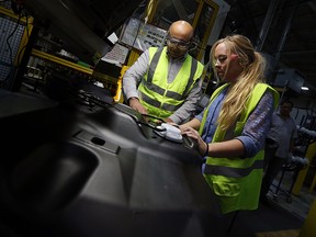 University of Windsor engineering student Katie Doe works with manager Syed Jafri at the Kautex plant in Windsor on Wednesday, October 19, 2016. The Faculty of Engineering at the University of Windsor will host their Go Eng Girl event this Saturday. (TYLER BROWNBRIDGE / WINDSOR STAR)