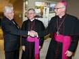 Honorary Co-Chair Paul Mullins, left, is introduced to Auxiliary Bishop Joseph Dabrowski, right, by Most Rev. Ronald Fabbro, Bishop of London during the 13th Annual Bishop's Dinner for Windsor-Essex held at the Ciociaro Club of Windsor October 27, 2016. Proceeds of the event support St. Peter's Seminary. Mary Ellen and Paul Mullins are Co-Chairs of the 2016 Bishop's Dinner.