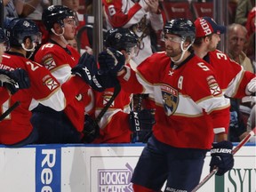 Aaron Ekblad (5) of the Florida Panthers is congratulated after scoring a second-period goal to tie the game against the Colorado Avalanche at the BB&T Center on Oct. 22, 2016 in Sunrise, Fla.