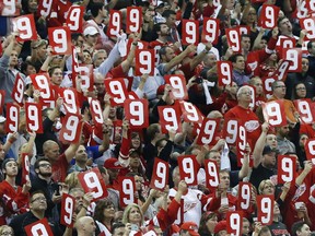 Fans hold up the No. 9 in honour of the late Gordie Howe in the first period of the Detroit Red Wings' last home opener at Joe Louis Arena on Oct. 17, 2016 in Detroit.