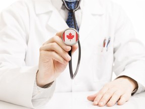 Doctor holding stethoscope with flag series - Canada. Photo by Getty Images.