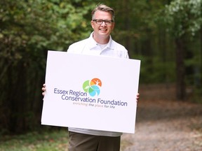 Richard Wyma, Essex Region Conservation Authority general manager and executive director of the Essex Region Conservation Foundation, is shown on Oct. 12, 2016 in Windsor, Ont., with a sample of the organization's new "visual identity" material. A media conference was held at the Devonwood Conservation Area.