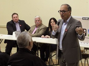 Rosario Marchese, chair of the Citizens Coalition Against Privatization, delivers a passionate address during the Let's Talk Hydro event hosted by MPPs Taras Natyshak, left, Percy Hatfield and Lisa Gretzky at St. Mary's Church Hall in Maidstone on Oct. 11, 2016.