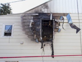 Red tape surrounds the side of home at 1680 Balfour Blvd., where a fire occurred late on Oct. 24, 2015.