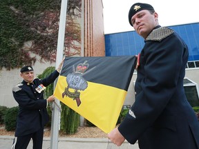 A flag raising ceremony was held at Windsor City Hall on Monday, Oct. 17, 2016 to commemorate the Windsor Regiment's 80-year history of service to the country. Lt.-Col. Nick Maroukis, commanding officer of the Windsor Regiment, left, and Sgt. Maj. Jamie Micallef were on hand to raise the flag.