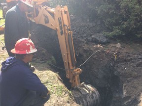 Crews monitor leaking gas from an abandoned well on Robson Road in Leamington in this handout photo.