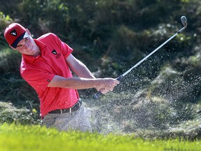 Dan Ludwick from Carleton University hits out of a bunker during the OUA Golf Championships at the Ambassador Golf Club in Windsor, Ont. on Monday, Oct. 17, 2016.