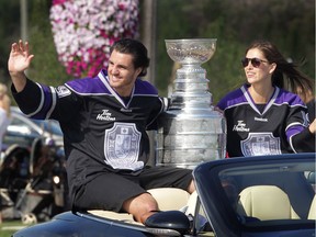 Los Angeles Kings player Kevin Westgarth and his wife Meagan arrive at the United Communities Credit Union complex in Amherstburg, Ont., on Aug. 21, 2012, with the Stanley Cup. Over 1,000 fans showed up to greet the Amherstburg native.