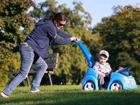 Michelle Loftus and her son Tyler, 1, enjoy a sunny day on Tuesday, Oct. 4, 2016 at the Alexander Park in Windsor.