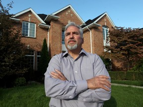 Chambers Drive resident Anthony Grassi stands in front of his Lakeshore home on Oct. 3, 2016. Grassi feels he's been let down by his insurance company following the recent flood which damaged many homes in his Orchard Park neighbourhood.